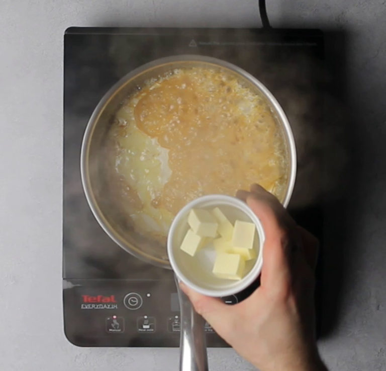 Adding butter to caramel sauce