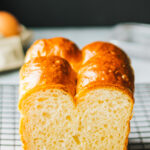 Brioche Bread cut open to reveal inner crumb