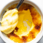 Spoonful of Crème Brulée sitting in ramekin