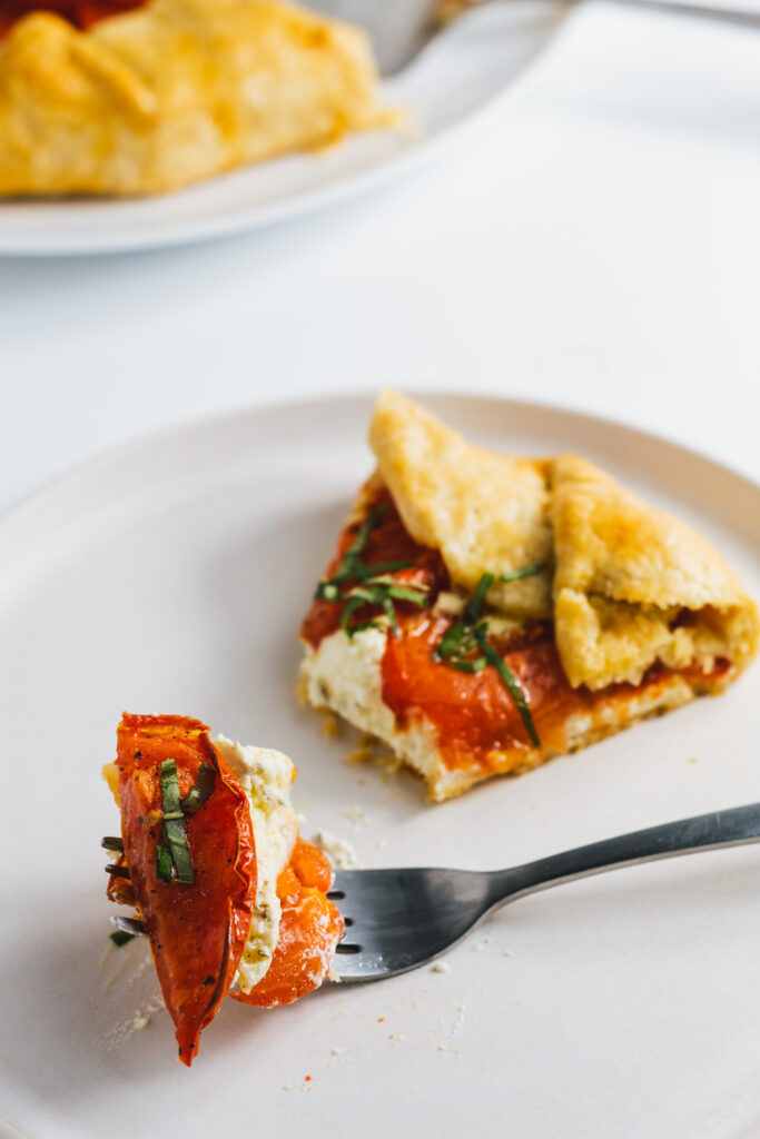 Slice of Tomato Galette with forkful