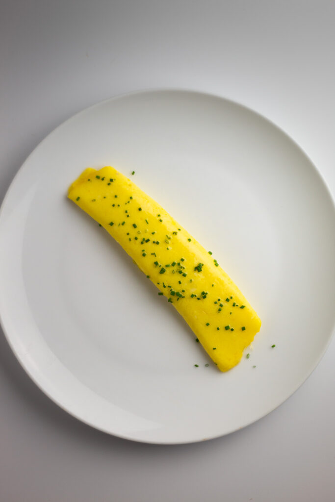 French Omelette and chives on a plate