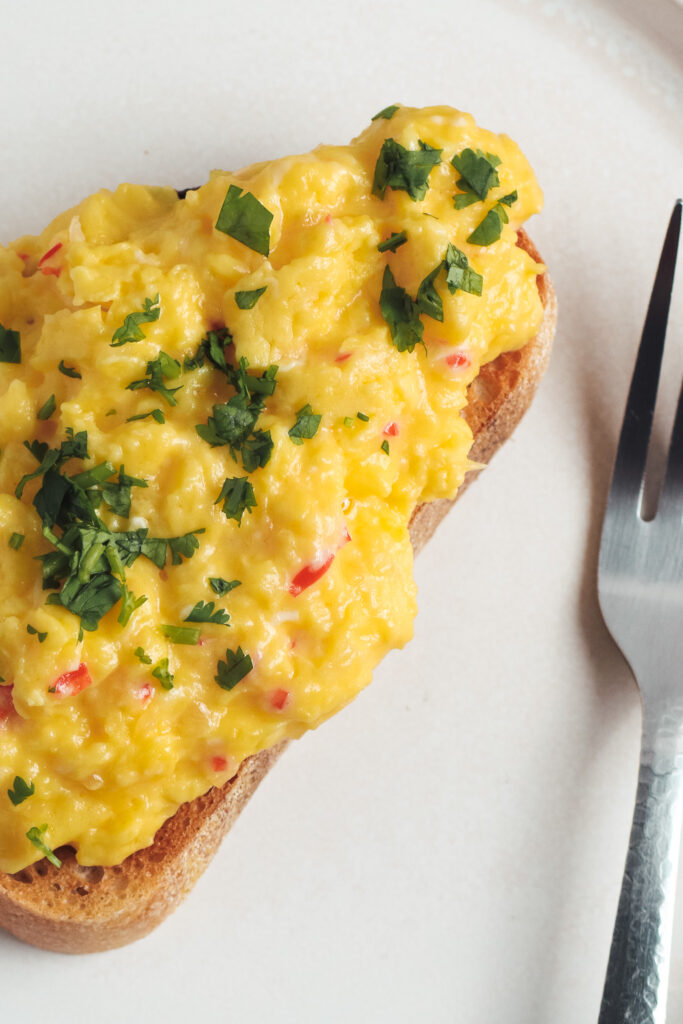 Scrambled eggs on toast on a plate