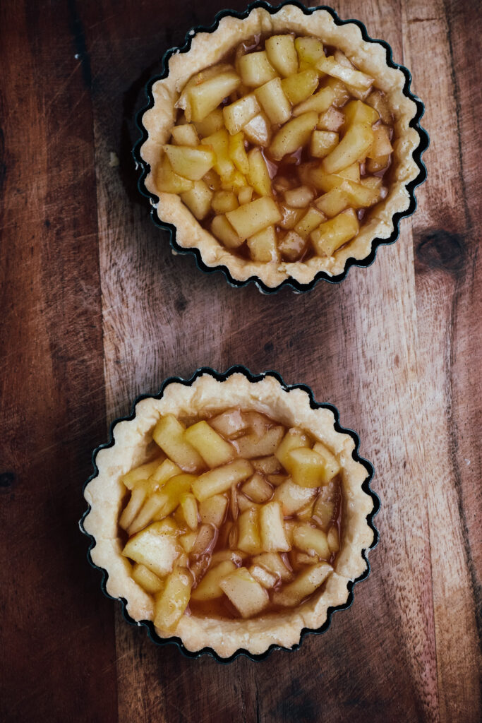 Apple crumble tarts shells filled with apples
