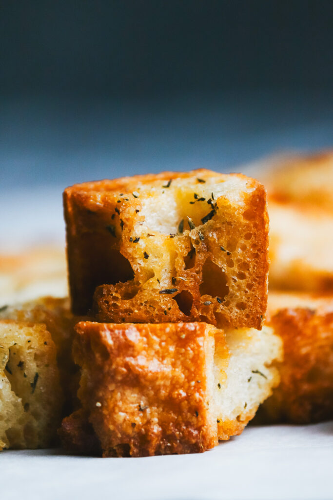 Close-up of two stacked croutons