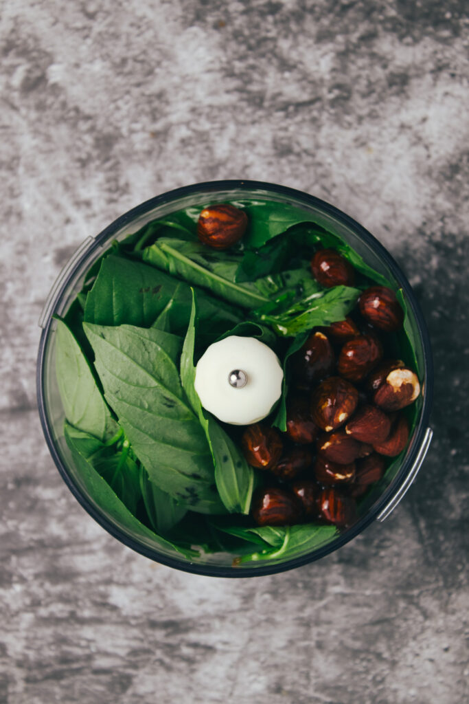 Basil and hazelnuts in a mini blender