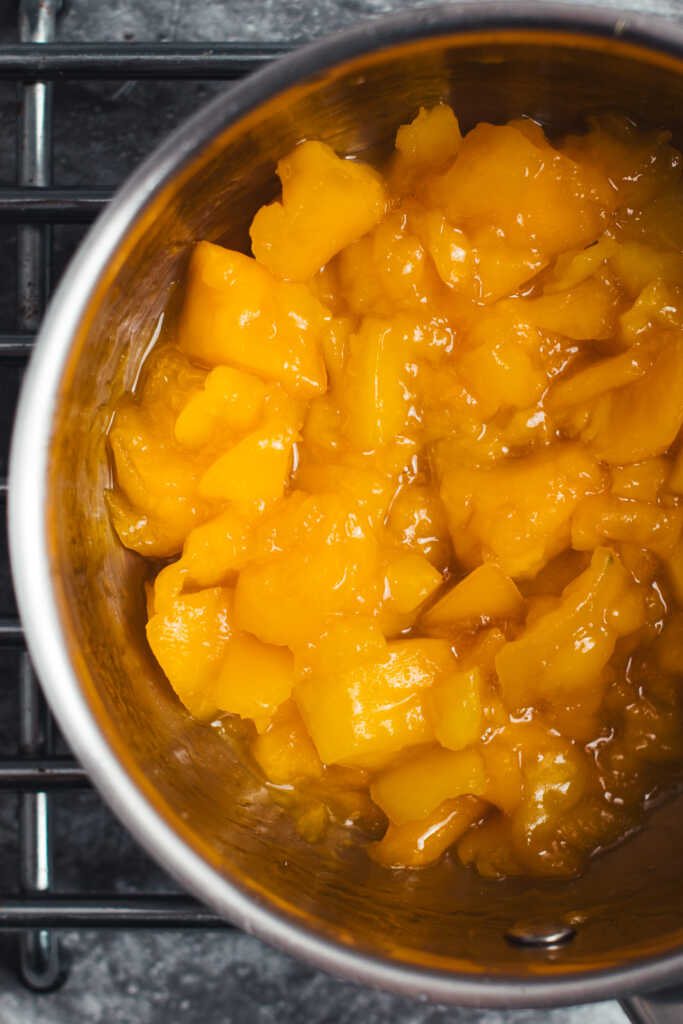 Close up of mango compote in a saucepan
