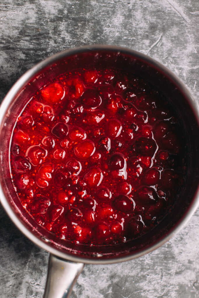 Cooked raspberries in a saucepan