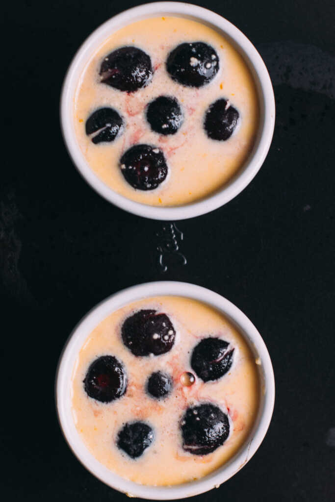 Easy Mini Cherry clafoutis batter in ramekins ready for the oven