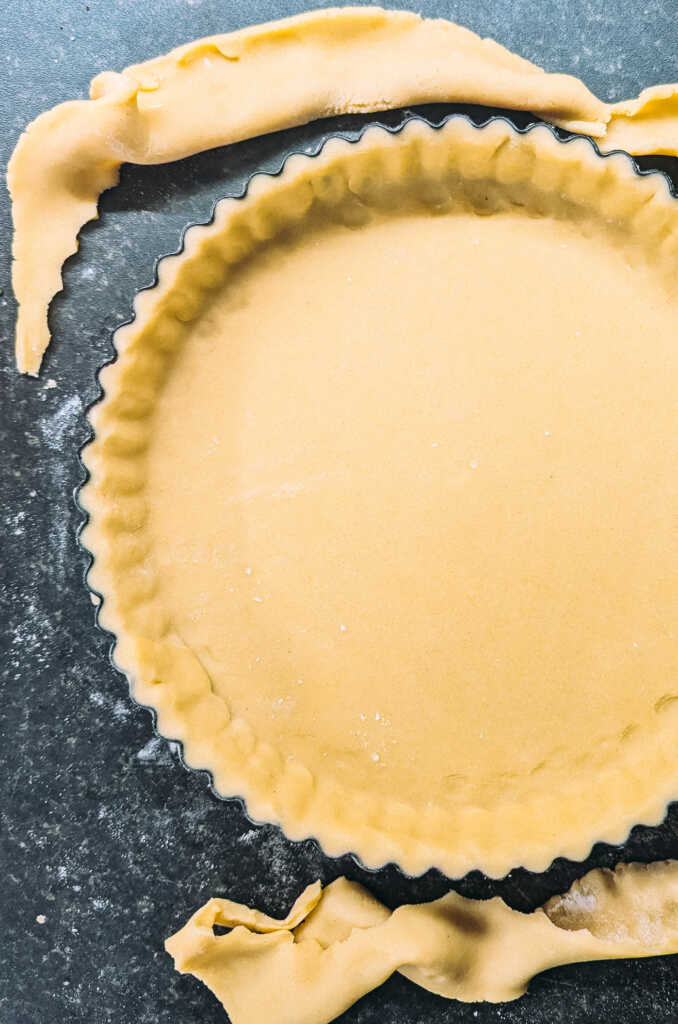 tart tin lined with shortcrust pastry