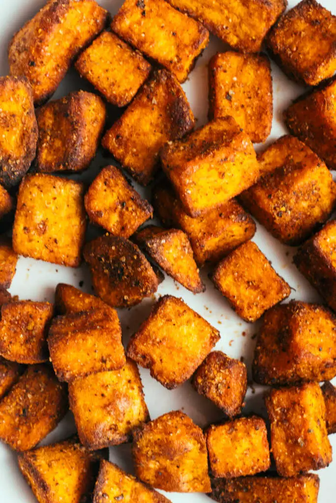 Close up of air fryer sweet potato cubes