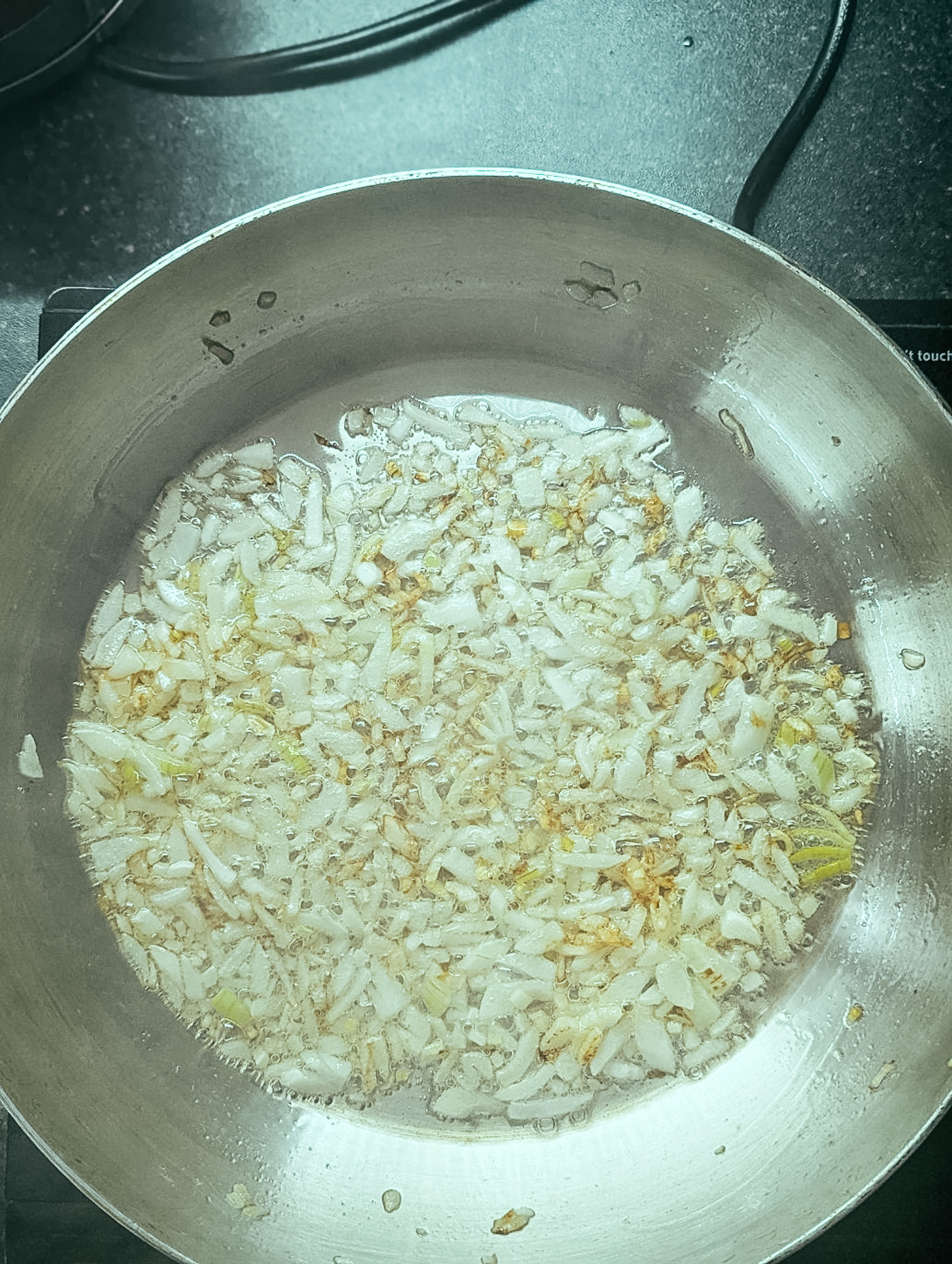 golden onions in a frying pan