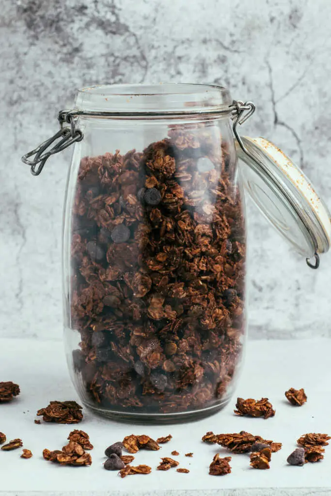 Glass jar filled with homemade mocha nut free granola.