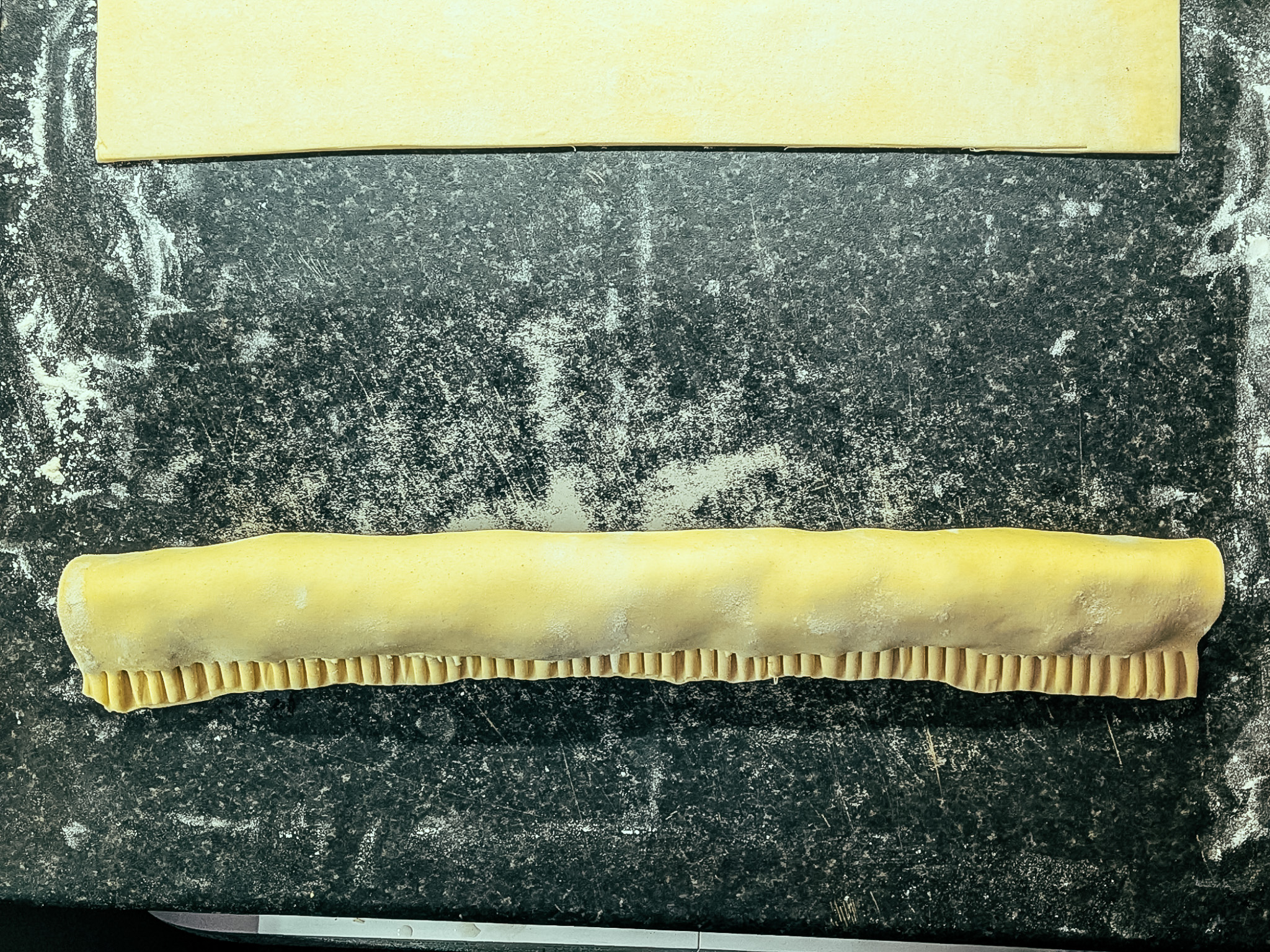 Rolled pastry filled with black pudding sausage mixture