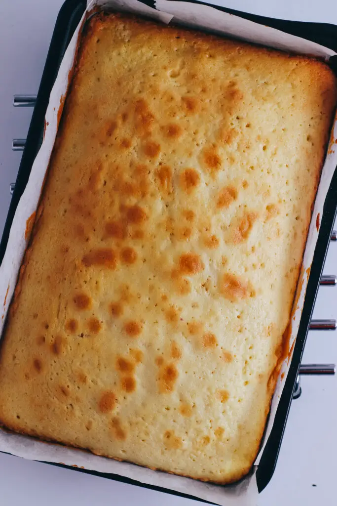 Golden vanilla traybake sponge just out of the oven.